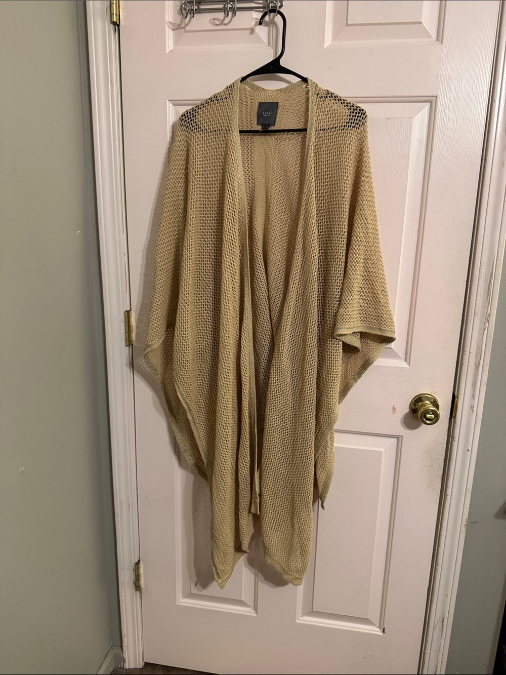 Lysse Open-Knit Draped Poncho in Beige with sequins trim.